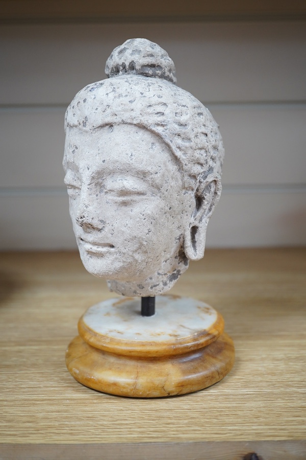 A stucco work head of Buddha, on marble stand, 21cm. Condition - fair